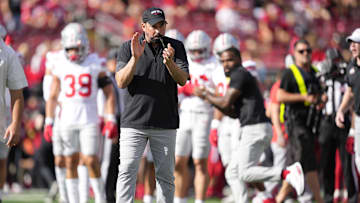 Oct 18, 2025; Madison, Wisconsin, USA; Ohio State Buckeyes head coach Ryan Day reacts in warm ups before the game against the Wisconsin Badgers at Camp Randall Stadium. Mandatory Credit: Jeff Hanisch-Imagn Images