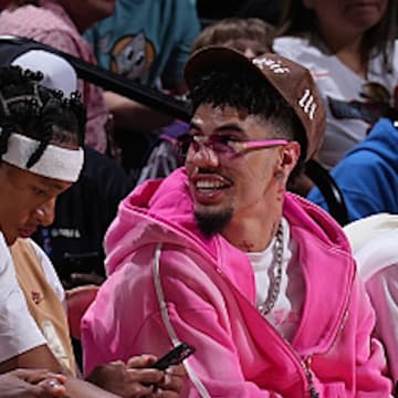LaMelo Ball sat courtside for the Hornets Summer League game on Friday in Las Vegas.