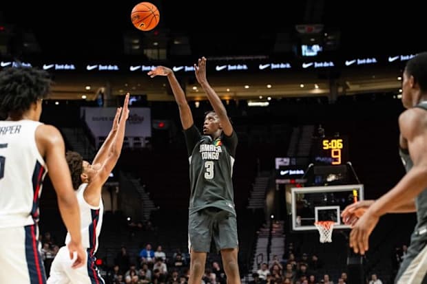 AJ Dybantsa, the nation's No. 1 prospect, rises for a shot during the 2024 Nike Hoop Summit at the Moda Center in Portland. 