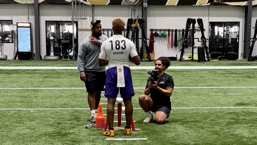 2027 Quarterback Peyton Houston listens to instruction at New Orleans Elite 11 Regional.