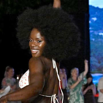 Tunde Oyeneyin walks the runway at the Sports Illustrated Swimsuit Runway Show
