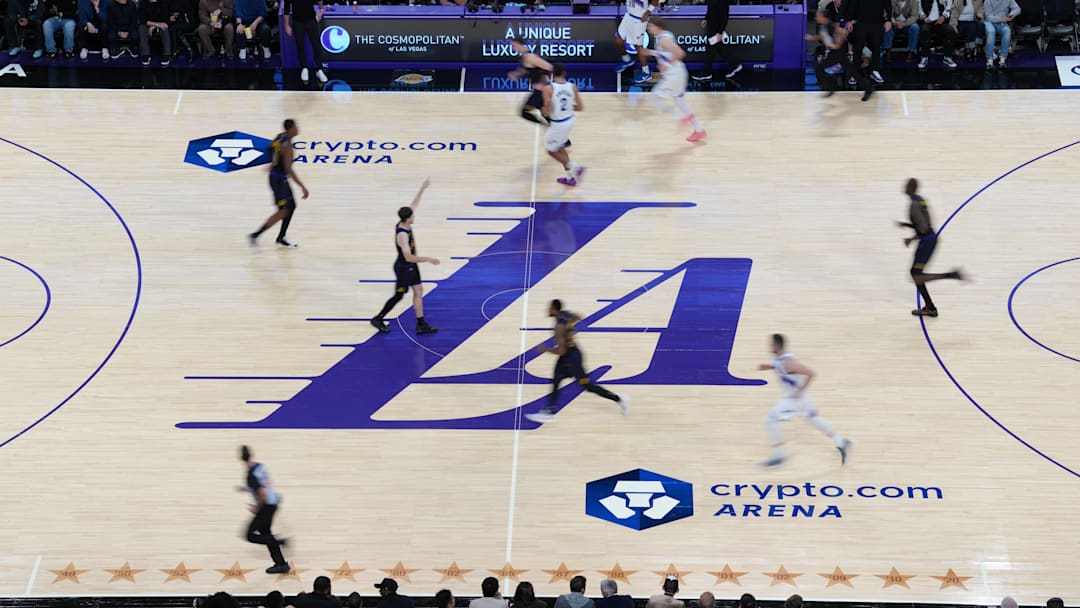 Nov 18, 2025; Los Angeles, California, USA; A general overall view of the Los Angeles Lakers city connect logo at midcourt against the Utah Jazz at Crypto.com Arena. Mandatory Credit: Kirby Lee-Imagn Images