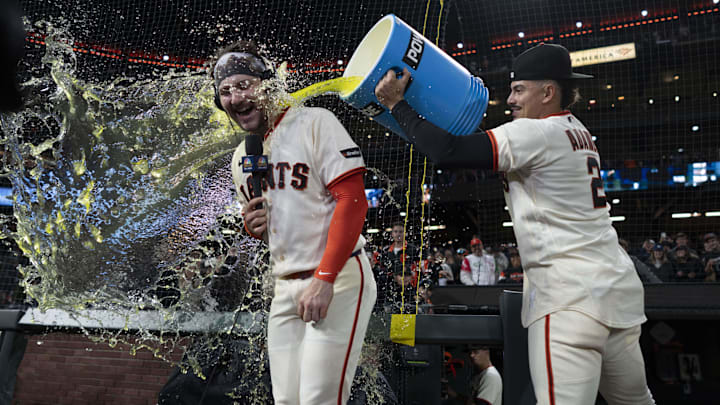 Apr 22, 2026; San Francisco, California, USA;  San Francisco Giants catcher Patrick Bailey (14) gets splashed by San Francisco Giants shortstop Willy Adames (2) after defeating the Los Angeles Dodgers at Oracle Park. Mandatory Credit: Stan Szeto-Imagn Images