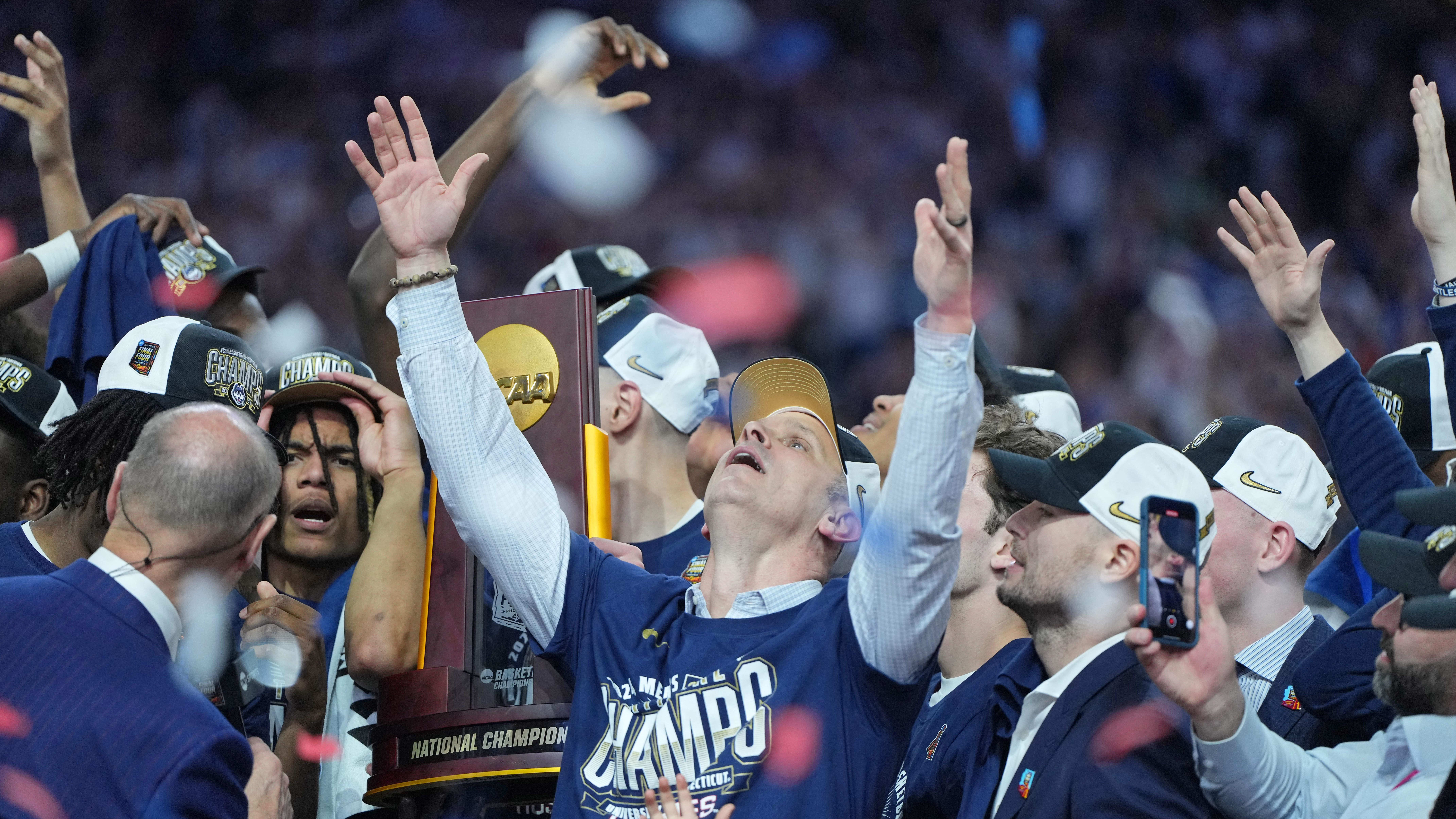 Hurley and the Huskies celebrate after winning the national championship.