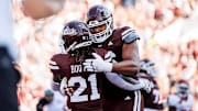 Mississippi State Running Back Davon Booth (#21) and Mississippi State Offensive Lineman Albert Reese IV (#76) during the game between the Arkansas Razorbacks and the Mississippi State Bulldogs at Davis Wade Stadium at Scott Field in Starkville, MS.