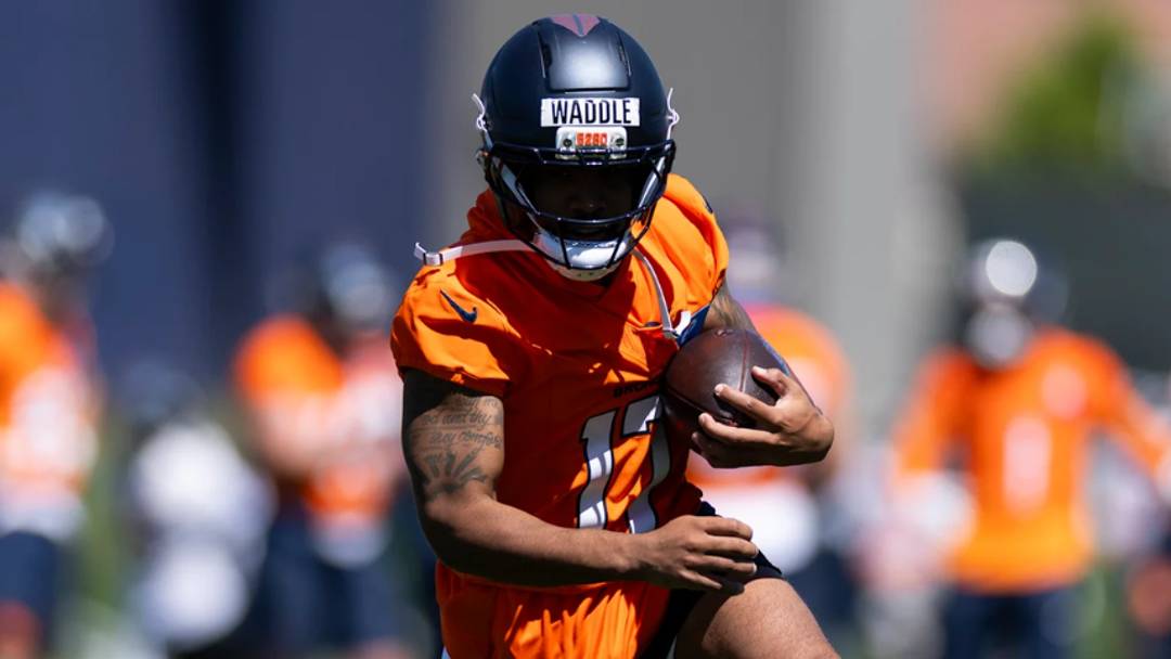 Denver Broncos wide receiver Jaylen Waddle catches a pass during OTA practice at Broncos Park Powered by CommonSpirit.