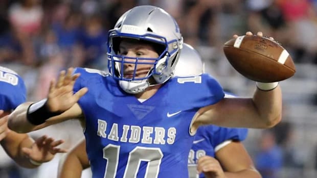 Atlee quarterback Tyler Warren prepares to throw the ball.