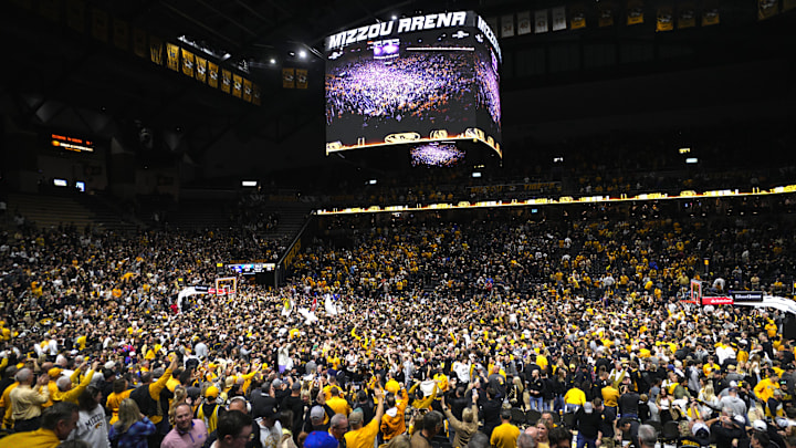 Missouri Tigers fans storm the court after defeating the Kansas Jayhawks at Mizzou Arena.