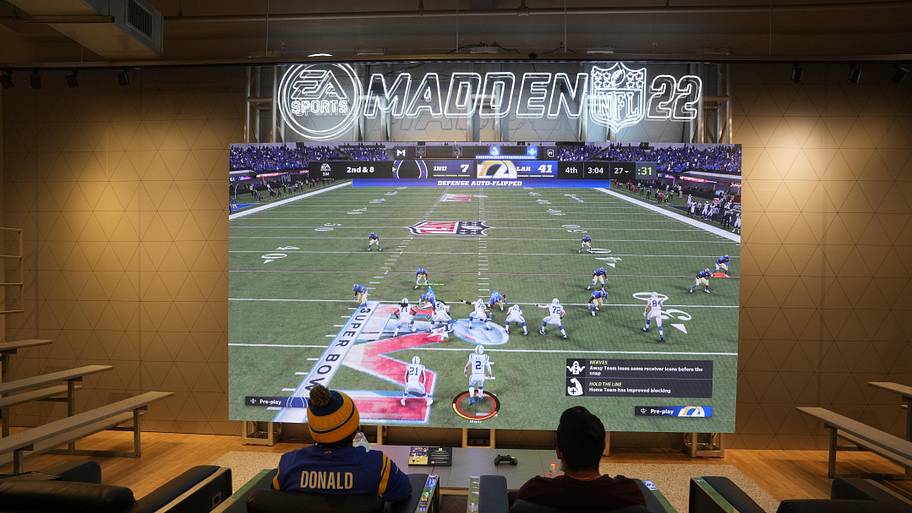 People play EA Sports Madden NFL video game at the Nike store at the Grove. 