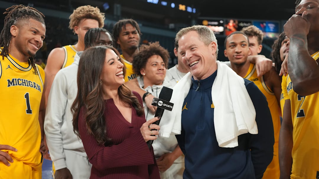 Nov 25, 2025; Las Vegas, NV, USA; TNT Sports reporter Lauren Jbara (left) interviews Michigan Wolverines head coach Dusty May after a 2025 Players Era Festival group play game against the Auburn Tigers at Michelob ULTRA Arena. Mandatory Credit: Kirby Lee-Imagn Images
