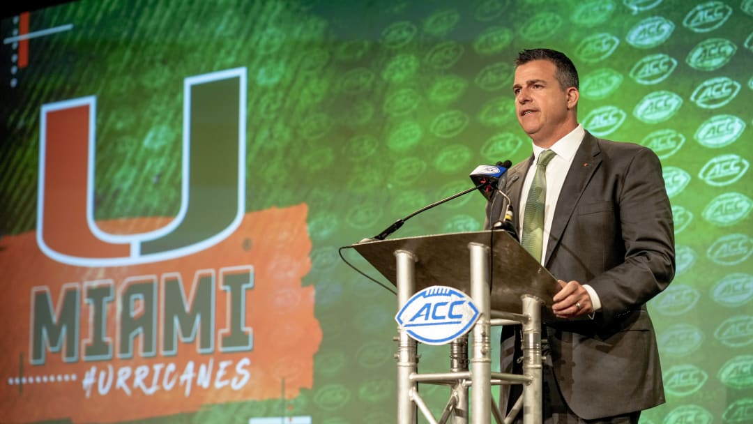 Jul 21, 2022; Charlotte, NC, USA;  Miami head coach Mario Cristobal talks to the media during the second day of ACC Media Days at the Westin Hotel in Charlotte, NC. Mandatory Credit: Jim Dedmon-USA TODAY Sports