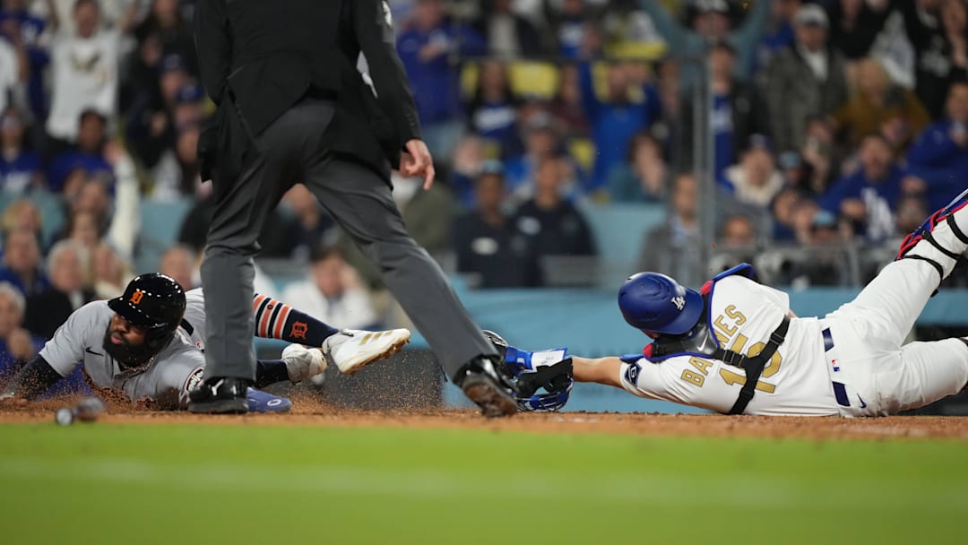 Mar 28, 2025; Los Angeles, California, USA;  Los Angeles Dodgers catcher Austin Barnes (15) tags Detroit Tigers outfielder Manuel Margot (7) during the nineth inning at Dodger Stadium. Mandatory Credit: Kirby Lee-Imagn Images
