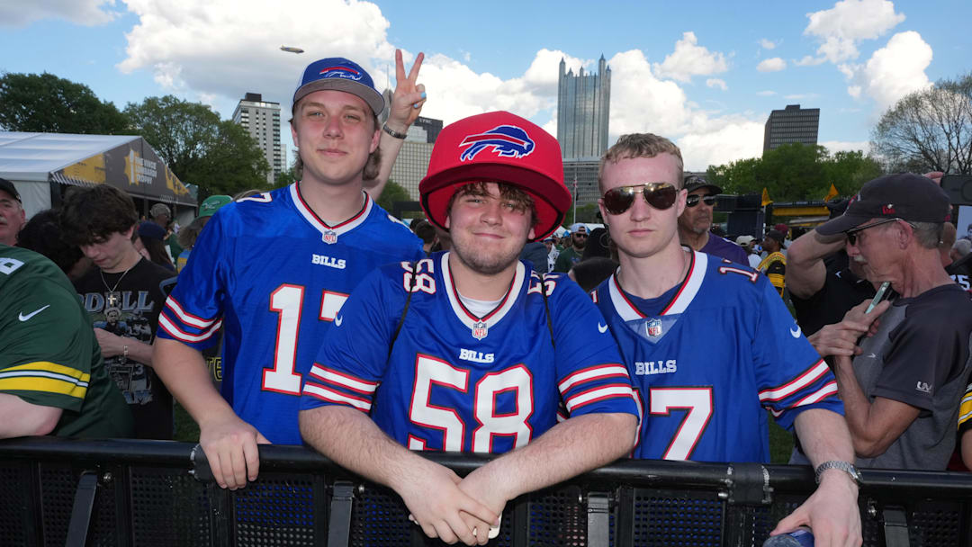 Apr 23, 2026; Pittsburgh, PA, USA; Buffalo Bills fans pose at the 2026 NFL Draft Experience at Point State Park.