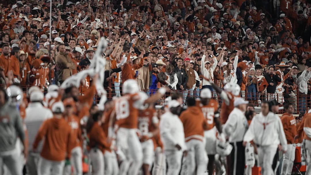Nov 28, 2025; Austin, Texas, USA; Texas Longhorns fans celebrate during the second half against the Texas A&M Aggies at Darrell K Royal-Texas Memorial Stadium. Mandatory Credit: Scott Wachter-Imagn Images Nov 28, 2025; Austin, Texas, USA; Texas Longhorns fans celebrate during the second half against the Texas A&M Aggies at Darrell K Royal-Texas Memorial Stadium. Mandatory Credit: Scott Wachter-Imagn Images