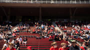 Fans wait to have items signed during the University of Cincinnati annual Red and Black Spring