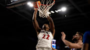Cincinnati Bearcats forward Arrinten Page (22) hits a layup around Kansas Jayhawks center Hunter Dickinson (1) in the second half of the NCAA basketball game at Fifth Third Arena in Cincinnati on Saturday, January 11, 2025.