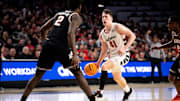 Cincinnati Bearcats guard Simas Lukosius (41) drives on Oklahoma State Cowboys forward Eric Dailey Jr. (2) in the second half of the NCAA basketball game between Cincinnati Bearcats and Oklahoma State Cowboys at Fifth Third Arena in Cincinnati on Wednesday, Feb. 21, 2024.