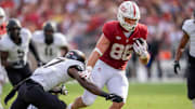 Oct 26, 2024; Stanford, California, USA;  Stanford Cardinal tight end Sam Roush (86) breaks a tackle by Wake Forest Demon Deacons defensive back Zamari Stevenson (17) during the fourth quarter at Stanford Stadium. Mandatory Credit: Neville E. Guard-Imagn Images