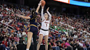 Mar 9, 2024; Greensboro, NC, USA; Notre Dame Fighting Irish guard Sonia Citron (11) blocks the attempted shot of Virginia Tech Hokies guard Carleigh Wenzel (1) in the first half at Greensboro Coliseum. Mandatory Credit: David Yeazell-Imagn Images