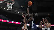 Penn State Nittany Lions guard D'Marco Dunn (2) shoots the ball against Southern California Trojans guard Clark Slajchert (32) in the first half at Galen Center. 