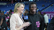 Feb 28, 2025; Indianapolis, IN, USA; Stacey Dales interviews Colorado defensive back Travis Hunter (DB15) looks on during the 2025 NFL Combine at Lucas Oil Stadium. Mandatory Credit: Kirby Lee-Imagn Images