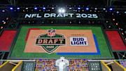 The Green Bay 2025 logo on the main stage before the NFL Draft at Lambeau Field.