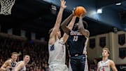 Gonzaga Bulldogs forward Graham Ike (13) drives to the net while being defended by St. Mary's Gaels center Harry Wessels (1)
