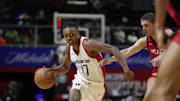Jul 12, 2024; Las Vegas, NV, USA;  Washington Wizards guard Bub Carrington (17) drives the ball against Atlanta Hawks guard Nikola Durisic (7) during the second half at Thomas & Mack Center. Mandatory Credit: Lucas Peltier-Imagn Images