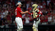 Cincinnati Reds pitcher Emilio Pagán (15) greets Cincinnati Reds catcher Jose Trevino (35) after the MLB game between Cincinnati Reds and Cleveland Guardians at Great American Ball Park in Cincinnati on Saturday, May 17, 2025.