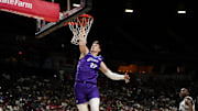 Jul 14, 2025; Las Vegas, NV, USA;  Utah Jazz forward Kyle Filipowski (22) dunks the ball against the San Antonio Spurs during the first half of a NBA basketball game at the Thomas & Mack Center. Mandatory Credit: Lucas Peltier-Imagn Images