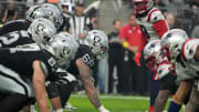 Dec 18, 2022; Paradise, Nevada, USA; A general overall view of helmets at the line of scrimmage as Las Vegas Raiders center Andre James (68 snaps the ball against the New England Patriots at Allegiant Stadium. The Raiders defeated the Patriots 30-24. Mandatory Credit: Kirby Lee-USA TODAY Sports