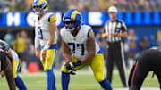 Sep 7, 2025; Inglewood, California, USA; Los Angeles Rams offensive tackle Alaric Jackson (77) wears a Guardian helmet cap in the second half against the Houston Texans at SoFi Stadium. Mandatory Credit: Kirby Lee-Imagn Images