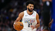 Nov 25, 2024; Denver, Colorado, USA; Denver Nuggets guard Jamal Murray (27) dribbles the ball in the first quarter against the New York Knicks at Ball Arena. Mandatory Credit: Ron Chenoy-Imagn Images