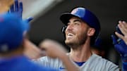 Chicago Cubs center fielder Cody Bellinger celebrates in the dugout after hitting a solo home run during a 2023 game against the Cincinnati Reds at Great American Ball Park.