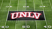 The UNLV Rebels logo at midfield during the Mountain West Championship at Allegiant Stadium. Mandatory Credit: Kirby Lee-Imagn Images