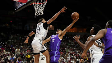 Jul 14, 2025; Las Vegas, NV, USA;  Utah Jazz forward John Tonje (17) drives towards the basket against San Antonio Spurs forward Carter Bryant (11) during the first half of a NBA basketball game at the Thomas & Mack Center. Mandatory Credit: Lucas Peltier-Imagn Images