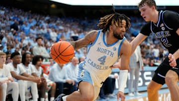 Mar 8, 2025; Chapel Hill, North Carolina, USA;  North Carolina Tar Heels guard RJ Davis (4) with the ball as Duke Blue Devils forward Cooper Flagg (2) defends.