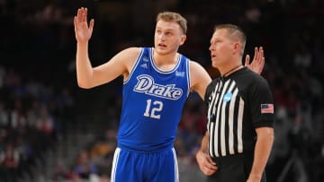 Drake Bulldogs guard Tucker DeVries (12) talks to an official in a first-round NCAA Tournament game between Drake and Washington State, Thursday, March 21, 2024 at CHI Health Center Arena in Omaha.