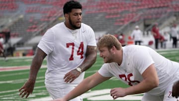 Alabama offensive lineman Kadyn Proctor (74) is shown with offensive lineman Wilkin Formby (75)