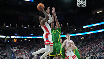 Mar 15, 2024; Las Vegas, NV, USA; Arizona Wildcats guard Caleb Love (2) shoots the ball against Oregon Ducks forward Kwame Evans Jr. (10) in the first half at T-Mobile Arena. Mandatory Credit: Kirby Lee-Imagn Images