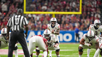 Dec 28, 2023; San Antonio, TX, USA;  Arizona Wildcats quarterback Noah Fifita (11) gets ready to take a snap in the first half against the Oklahoma Sooners at Alamodome. Mandatory Credit: Daniel Dunn-Imagn Images