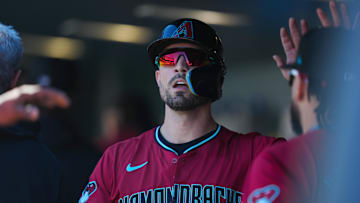 Sep 18, 2024; Denver, Colorado, USA; Arizona Diamondbacks outfielder Randal Grichuk (15) celebrates scoring a run in the first inning against the Colorado Rockies at Coors Field. Mandatory Credit: Ron Chenoy-Imagn Images