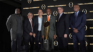 Jan 21, 2025; Atlanta, GA, USA; From left: Miami Dade County supervisor Jimmy Morales, Orange Bowl chief executive officer Eric Poms, Miami Dade County commissioner Oliver Gilbet, Miami 2026 College Football Playoff host committee member Jack Seiler and CFP executive director Rich Clark pose during the CFP National Championship Host Committee handoff press conference at The Westin Peachtree Plaza, Savannah Ballroom. Mandatory Credit: Kirby Lee-Imagn Images