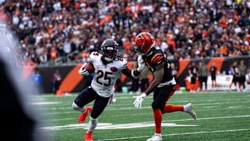 Chicago Bears running back Kyle Monangai (25) stiff arms Cincinnati Bengals cornerback Dax Hill (23) in the second quarter of the NFL football game between Chicago Bears and Cincinnati Bengals at Paycor Stadium in Cincinnati on Nov. 2, 2025.