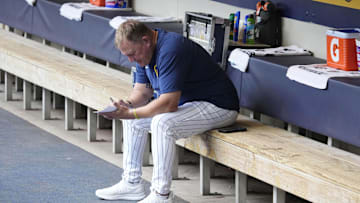 Jun 29, 2025; Milwaukee, Wisconsin, USA; Milwaukee Brewers manager Pat Murphy (49) works on his line card before their game against the Colorado Rockies at American Family Field. Mandatory Credit: Michael McLoone-Imagn Images
