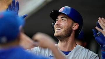 Chicago Cubs center fielder Cody Bellinger (24) celebrates in the dugout after hitting a solo home