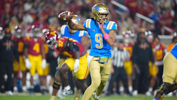 Nov 29, 2025; Los Angeles, California, USA; UCLA Bruins quarterback Nico Iamaleava (9) throws the ball against the Southern California Trojans in the first half at United Airlines Field at Los Angeles Memorial Coliseum. Mandatory Credit: Kirby Lee-Imagn Images