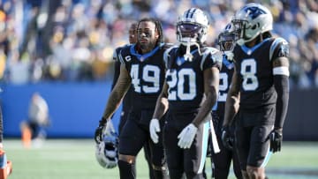 Dec 24, 2023; Charlotte, North Carolina, USA; Carolina Panthers linebacker Frankie Luvu (49) and the defense walk to the opposite goal line at the quarter end against the Green Bay Packers during the second quarter at Bank of America Stadium. Mandatory Credit: Jim Dedmon-USA TODAY Sports