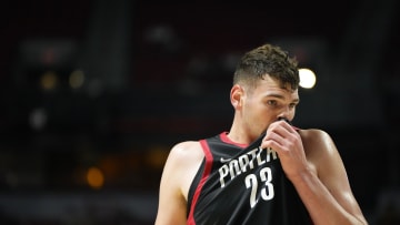 Jul 15, 2024; Las Vegas, NV, USA; Portland Trail Blazers center Donovan Clingan (23) wipes his face with his jersey during the first half against the Philadelphia 76ers at Thomas & Mack Center. Mandatory Credit: Lucas Peltier-USA TODAY Sports