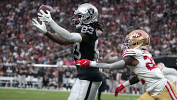 Aug 13, 2023; Paradise, Nevada, USA; Las Vegas Raiders wide receiver Kristian Wilkerson (83) catches the ball against San Francisco 49ers cornerback D'Shawn Jamison (22) in the second half at Allegiant Stadium